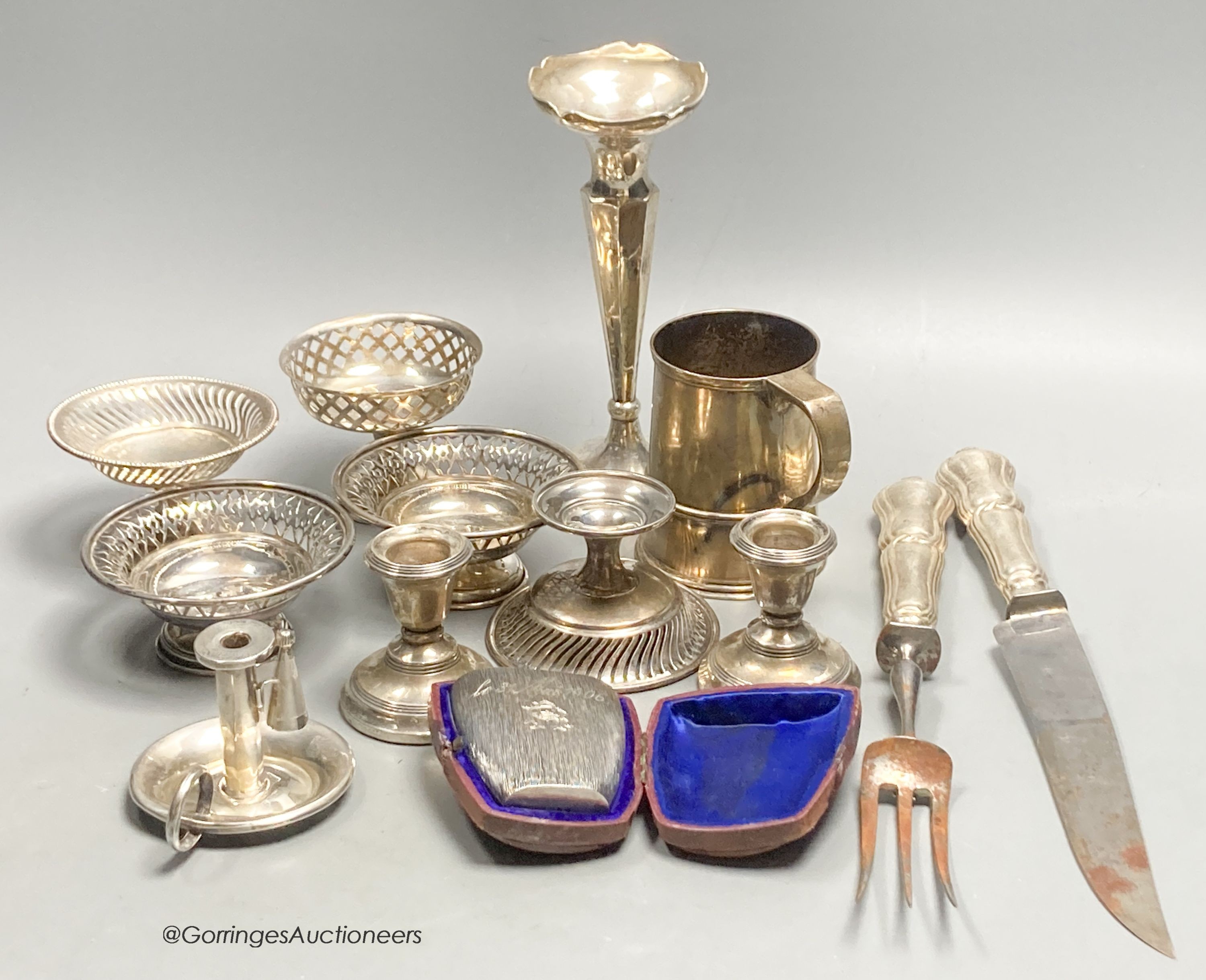 A group of assorted small silver etc. including two pairs of nit dishes, christening mug, spill vase, chamberstick, pair of dwarf candlesticks, pedestal dish, carving set and cased textured cup